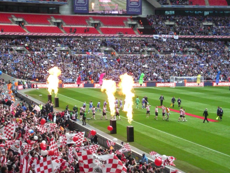 The teams take to the pitch